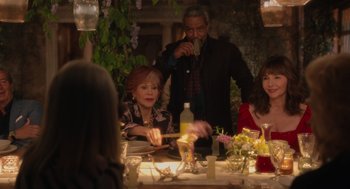 Movie still from “Book Club: The Next Chapter” (2023), directed by Bill Holderman – A group of people sitting at a table with food; Medium shot, Over the shoulder angle
