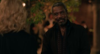 Movie still from “Book Club: The Next Chapter” (2023), directed by Bill Holderman – An older man is smiling for the camera; Close Up shot, Over the shoulder angle