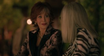 Movie still from “Book Club: The Next Chapter” (2023), directed by Bill Holderman – A woman in a black and white jacket talking to another woman; Close Up shot, Over the shoulder angle