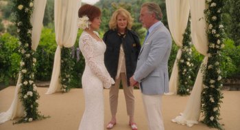 Movie still from “Book Club: The Next Chapter” (2023), directed by Bill Holderman – A man and a woman holding hands with another woman; Wide shot, Over the shoulder angle