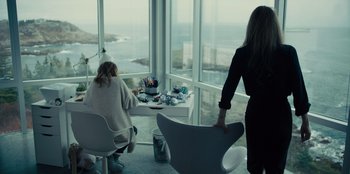 Movie still from “Books of Blood” (2020), directed by Brannon Braga – Two women sitting in front of a large window; Wide shot, Over the shoulder angle