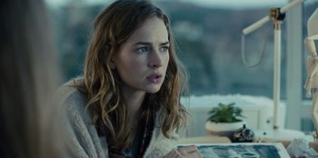 Movie still from “Books of Blood” (2020), directed by Brannon Braga – A young woman sitting in front of a window; Close Up shot, Over the shoulder angle