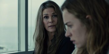 Movie still from “Books of Blood” (2020), directed by Brannon Braga – A woman sitting in front of another woman in front of a window; Close Up shot, Over the shoulder angle