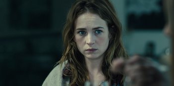 Movie still from “Books of Blood” (2020), directed by Brannon Braga – A person with long brown hair; Close Up shot, Over the shoulder angle