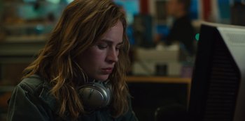 Movie still from “Books of Blood” (2020), directed by Brannon Braga – A woman with long red hair wearing a pair of headphones; Close Up shot, Low angle