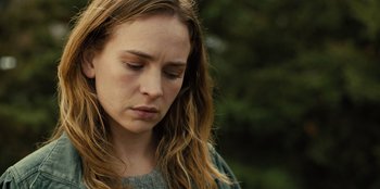 Movie still from “Books of Blood” (2020), directed by Brannon Braga – A person with long hair looking down; Close Up shot, Over the shoulder angle