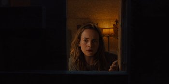 Movie still from “Books of Blood” (2020), directed by Brannon Braga – A woman looking out of a window at night; Close Up shot, Over the shoulder angle