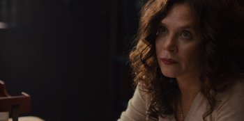 Movie still from “Books of Blood” (2020), directed by Brannon Braga – A person sitting in front of a window; Close Up shot, Over the shoulder angle