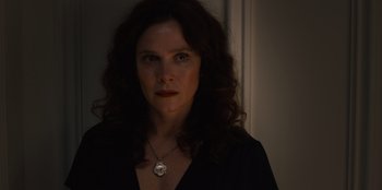 Movie still from “Books of Blood” (2020), directed by Brannon Braga – A person wearing a necklace; Close Up shot, Low angle