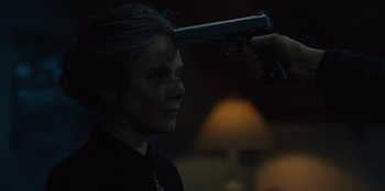 Movie still from “Books of Blood” (2020), directed by Brannon Braga – A woman is holding a gun up to her head; Close Up shot, Over the shoulder angle