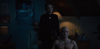 Movie still from “Books of Blood” (2020), directed by Brannon Braga – A woman standing next to a man and a boy; Medium shot, Over the shoulder angle