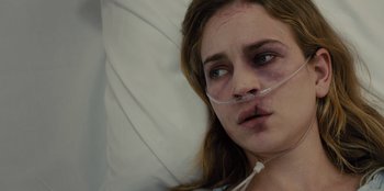 Movie still from “Books of Blood” (2020), directed by Brannon Braga – A young woman laying in a hospital bed with her eyes wide open; Close Up shot, Over the shoulder angle