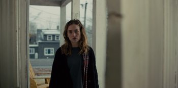 Movie still from “Books of Blood” (2020), directed by Brannon Braga – A woman standing in front of a building; Medium shot, Over the shoulder angle
