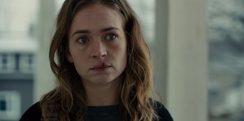 Movie still from “Books of Blood” (2020), directed by Brannon Braga – A person with long brown hair; Close Up shot, Over the shoulder angle