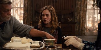 Movie still from “Books of Blood” (2020), directed by Brannon Braga – A woman sitting at a table with a cup of coffee; Medium shot, Over the shoulder angle