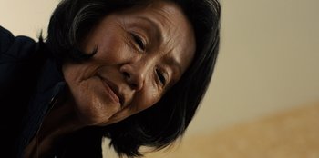 Movie still from “Books of Blood” (2020), directed by Brannon Braga – An older woman's face is shown in a close - up photo; Close Up shot, Low angle