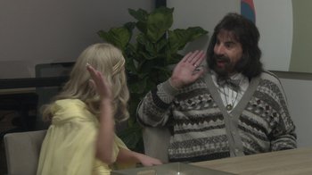 Movie still from “Borat Subsequent Moviefilm” (2020), directed by Jason Woliner – A man and a little girl are talking to each other; Medium shot, Over the shoulder angle