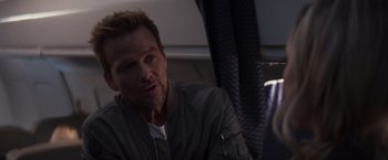 Movie still from “Born a Champion” (2021), directed by Alex Ranarivelo – A person sitting on a bus; Close Up shot, Over the shoulder angle