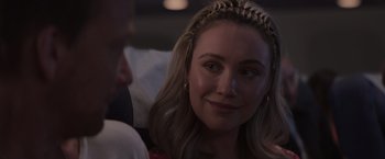 Movie still from “Born a Champion” (2021), directed by Alex Ranarivelo – A person sitting in a room; Close Up shot, Over the shoulder angle