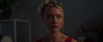 Movie still from “Born a Champion” (2021), directed by Alex Ranarivelo – A person wearing a red shirt; Close Up shot, Over the shoulder angle