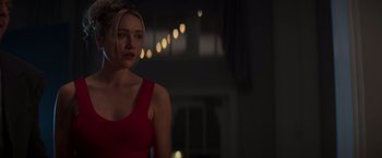 Movie still from “Born a Champion” (2021), directed by Alex Ranarivelo – A beautiful young lady in a red dress; Medium shot, Over the shoulder angle