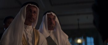 Movie still from “Born a Champion” (2021), directed by Alex Ranarivelo – Two middle eastern men in traditional clothing; Medium shot, Low angle