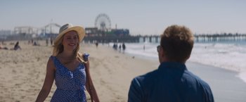 Movie still from “Born a Champion” (2021), directed by Alex Ranarivelo – A man and a woman on the beach near the water; Medium shot, Over the shoulder angle