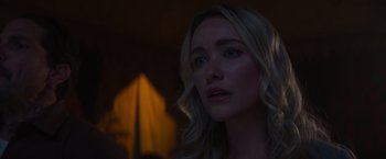 Movie still from “Born a Champion” (2021), directed by Alex Ranarivelo – A beautiful blonde haired woman looking into the distance; Close Up shot, Over the shoulder angle