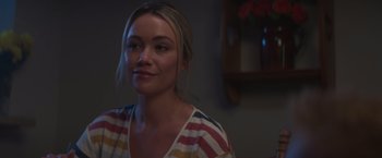 Movie still from “Born a Champion” (2021), directed by Alex Ranarivelo – A beautiful young lady sitting in front of a mirror; Close Up shot, Over the shoulder angle