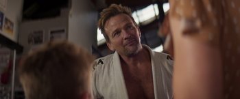 Movie still from “Born a Champion” (2021), directed by Alex Ranarivelo – A person wearing a robe; Close Up shot, Over the shoulder angle