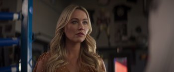 Movie still from “Born a Champion” (2021), directed by Alex Ranarivelo – A woman with long blonde hair looking to her left; Close Up shot, Over the shoulder angle