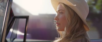 Movie still from “Born a Champion” (2021), directed by Alex Ranarivelo – A beautiful young lady wearing a white hat; Close Up shot, Over the shoulder angle