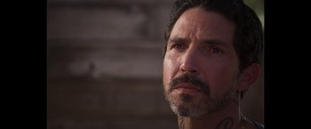 Movie still from “Born a Champion” (2021), directed by Alex Ranarivelo – A person with a beard; Close Up shot, Over the shoulder angle