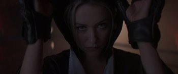 Movie still from “Born a Champion” (2021), directed by Alex Ranarivelo – A person wearing a hooded jacket; Close Up shot, Low angle
