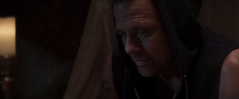 Movie still from “Born a Champion” (2021), directed by Alex Ranarivelo – A person wearing a hooded sweatshirt; Close Up shot, Low angle