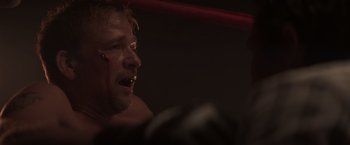 Movie still from “Born a Champion” (2021), directed by Alex Ranarivelo – A person in a boxing ring; Close Up shot, Over the shoulder angle