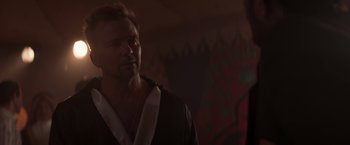 Movie still from “Born a Champion” (2021), directed by Alex Ranarivelo – A person wearing a robe; Close Up shot, Over the shoulder angle