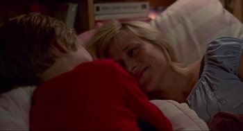 Movie still from “Boyhood” (2014), directed by Richard Linklater – A woman laying in bed next to a boy; Close Up shot, High angle