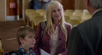 Movie still from “Boyhood” (2014), directed by Richard Linklater – A woman and a boy are standing next to each other; Medium shot, Over the shoulder angle