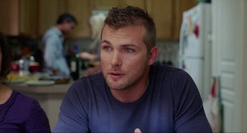 Movie still from “Boyhood” (2014), directed by Richard Linklater – A person sitting at a table in a kitchen; Close Up shot, Over the shoulder angle