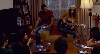 Movie still from “Boyhood” (2014), directed by Richard Linklater – A group of people sitting around a living room; Wide shot, Over the shoulder angle
