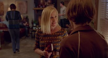 Movie still from “Boyhood” (2014), directed by Richard Linklater – A woman is talking to another woman at a party; Medium shot, Over the shoulder angle