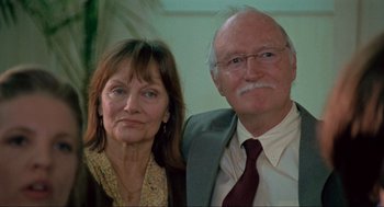 Movie still from “Boyhood” (2014), directed by Richard Linklater – An older man and a younger woman posing for a picture; Close Up shot, Low angle