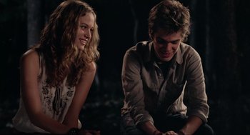 Movie still from “Boyhood” (2014), directed by Richard Linklater – A man and a woman sitting next to each other on the ground; Medium shot, Over the shoulder angle