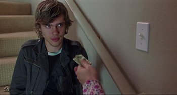 Movie still from “Boyhood” (2014), directed by Richard Linklater – A person holding a dollar bill in front of a mirror; Close Up shot, Over the shoulder angle