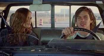 Movie still from “Boyhood” (2014), directed by Richard Linklater – A man and a woman sitting in the back of a car; Medium shot, Over the shoulder angle