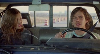 Movie still from “Boyhood” (2014), directed by Richard Linklater – Two people sitting in the back seat of a car; Close Up shot, Over the shoulder angle