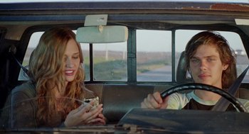 Movie still from “Boyhood” (2014), directed by Richard Linklater – Two people sitting in the back seat of a car; Medium shot, Over the shoulder angle