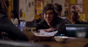 Movie still from “Boyhood” (2014), directed by Richard Linklater – A man sitting at a table in front of a bowl of food; Close Up shot, Over the shoulder angle