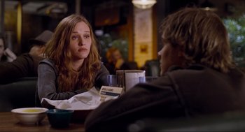 Movie still from “Boyhood” (2014), directed by Richard Linklater – A woman sitting at a table in front of a man; Medium shot, Over the shoulder angle